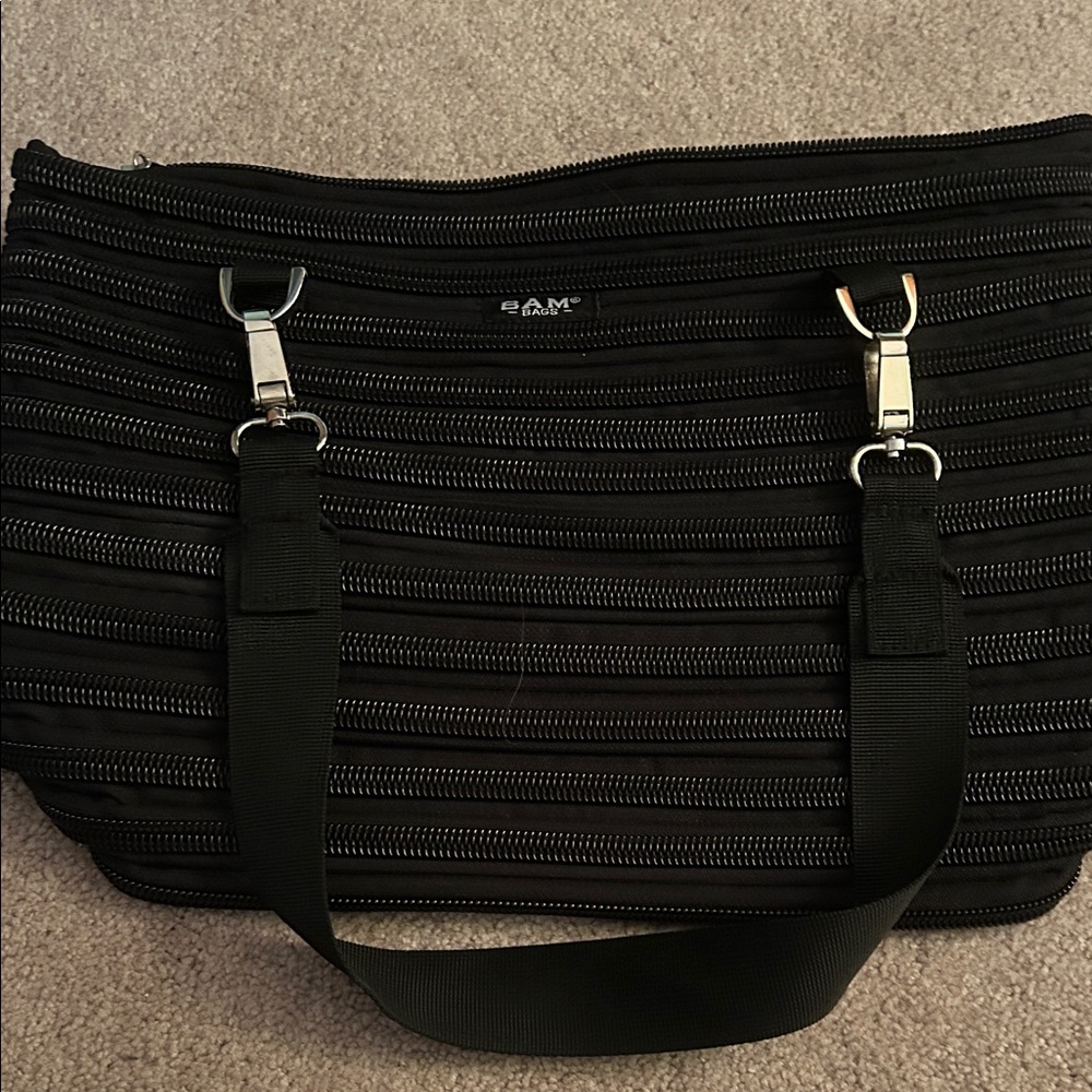 Bam Bags flat bottom bag made from a single,continuous zipper black
